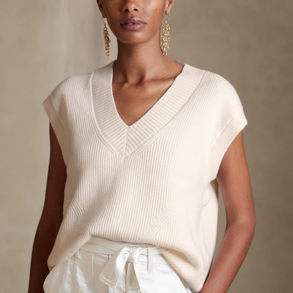White sleeveless V-neck sweater